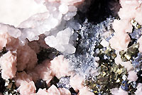 Plumosite, rhodochrosite, calcite, arsenopyrite
